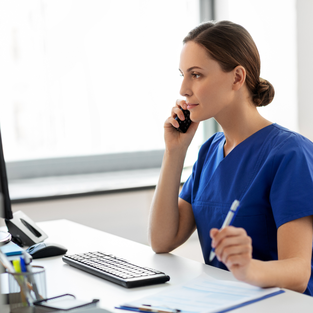 Nurse checking what schedule looks like in a clinic