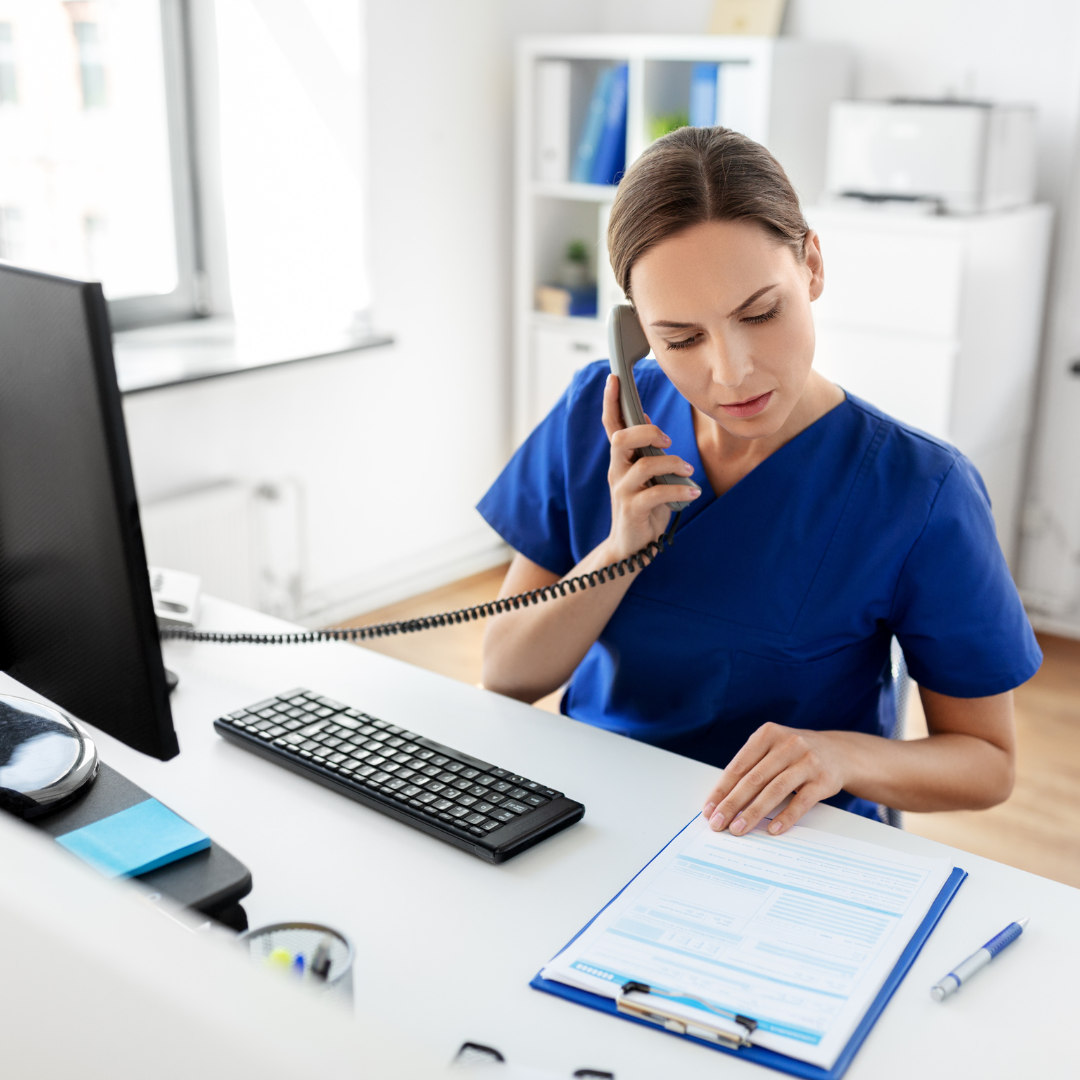 Nurse setting appointment in a clinic.